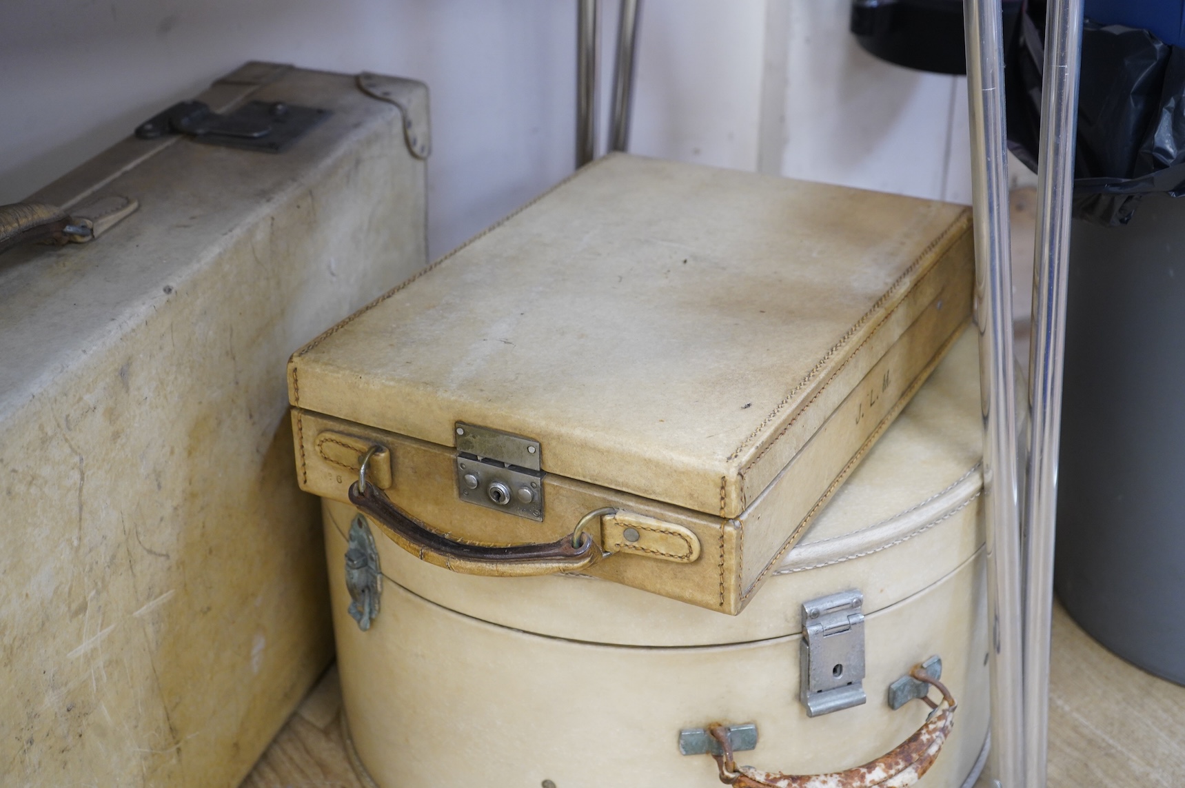 A collection of luggage comprising four vintage trunks and a hat box